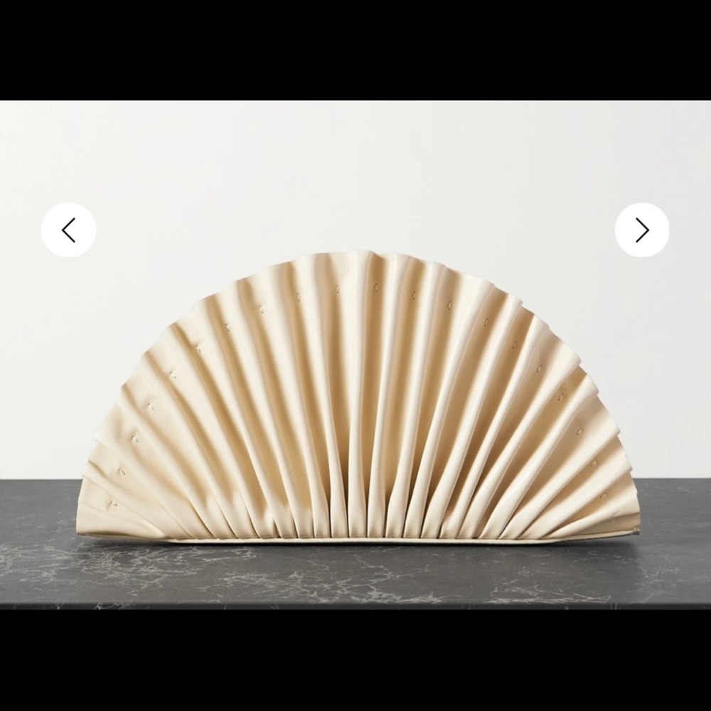 Cult Gaia off white 100% leather shell shaped silhouette clutch.